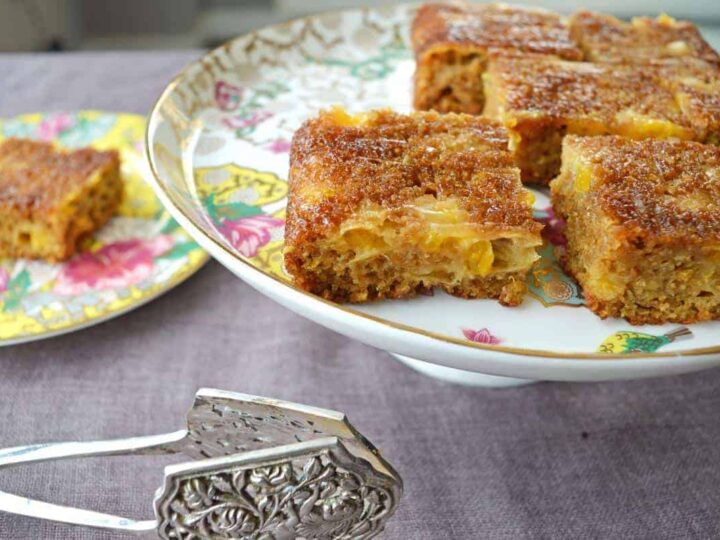Mandarin sheet cake on a porcelain serving plate