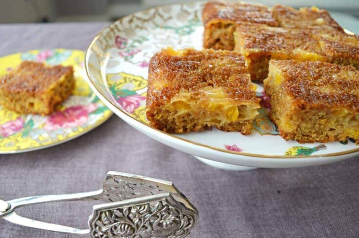 Mandarin sheet cake on a porcelain serving plate