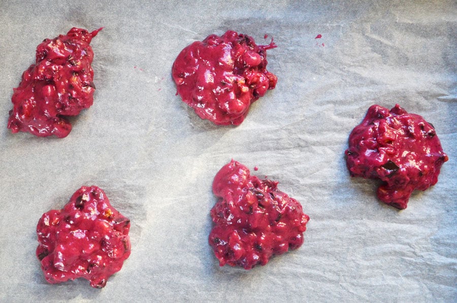 Scoops of pink cookie batter on baking paper
