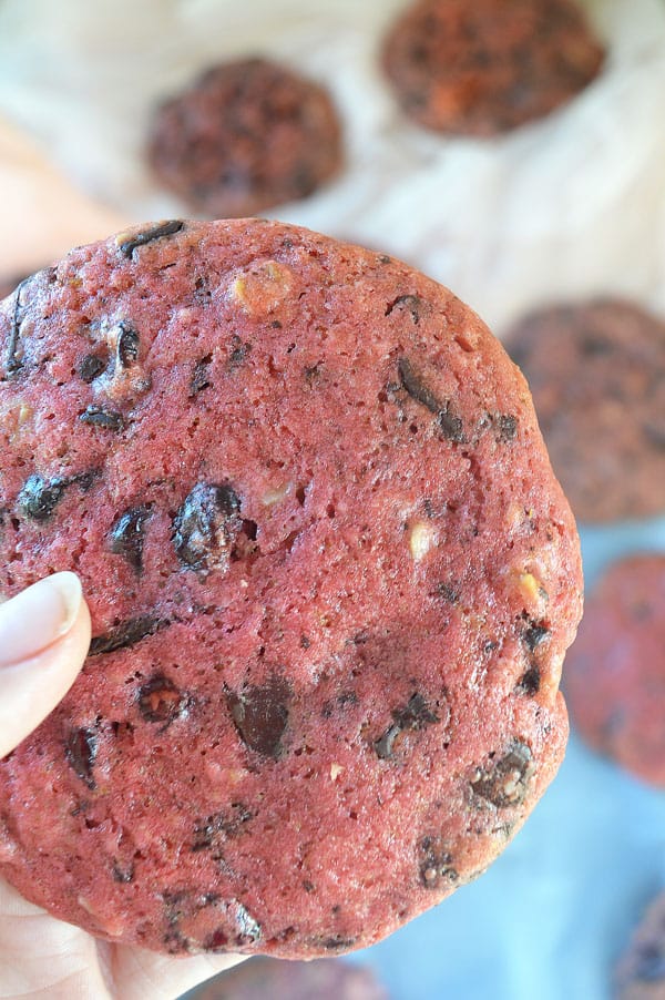 A pink chocolate walnut cookie close-up