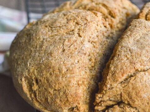 A side view of soda bread with a dark background