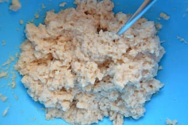Mashed bread and tea in a white bowl