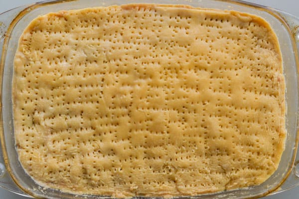 A top layer of shortcrust pastry in a glass dish