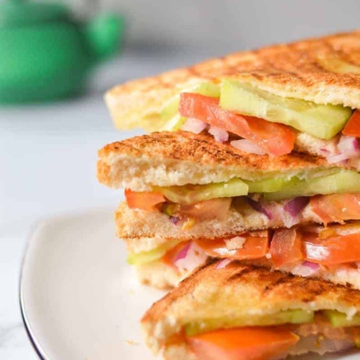 four onion tomato and cucumber sandwiches