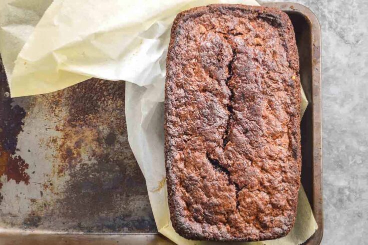 A chocolate banana bread on a tin