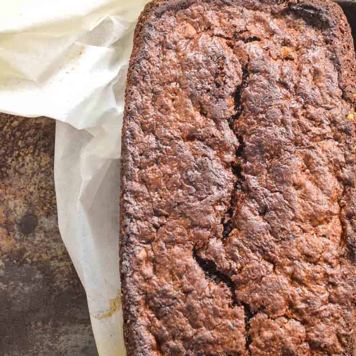 Chocolate banana bread on baking paper in a tin