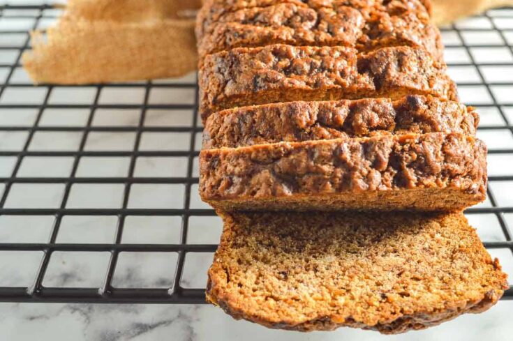 Slices of banana bread on a black cooling cookie rack