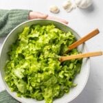Pinterest pin image of green salad with text "GARLIC Salad!".