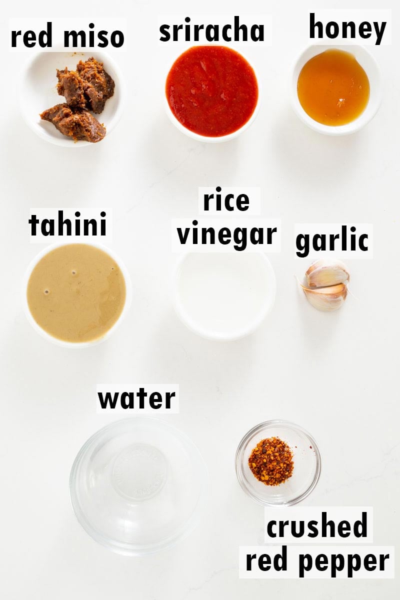 Labelled ingredients including red miso, sriracha, honey, tahini, rice vinegar, garlic, water and crushed red pepper.
